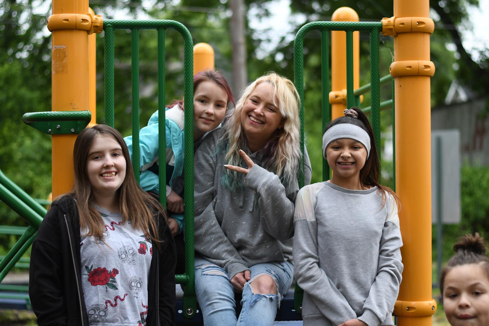 happy Evansville people on a playground at a Learners of Christ the King United event